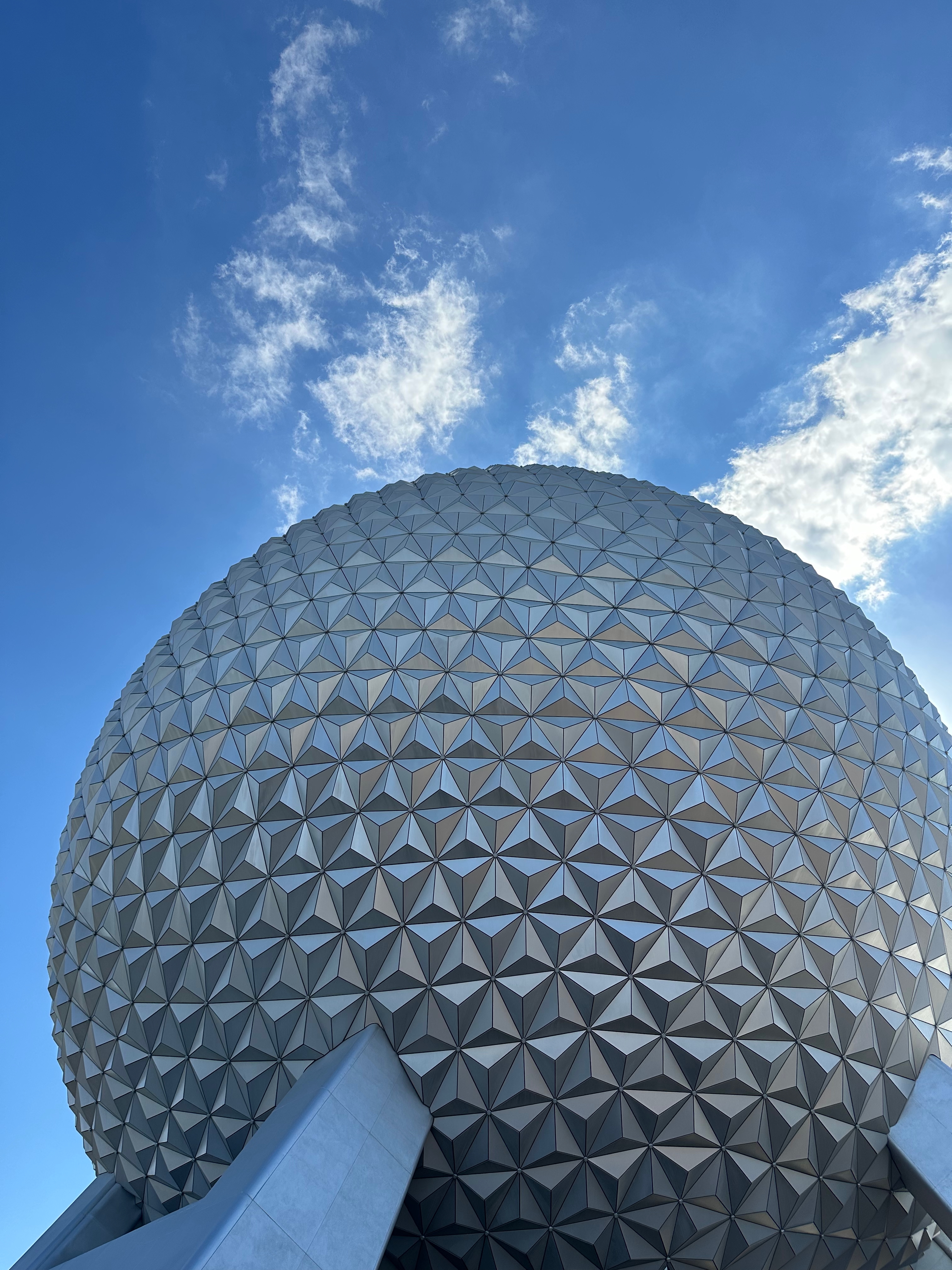 Spaceship Earth at EPCOT beneath a bright blue sky in Orlando